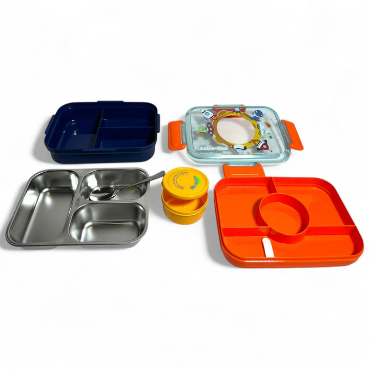 Collection of children's lunch boxes and containers on a white background