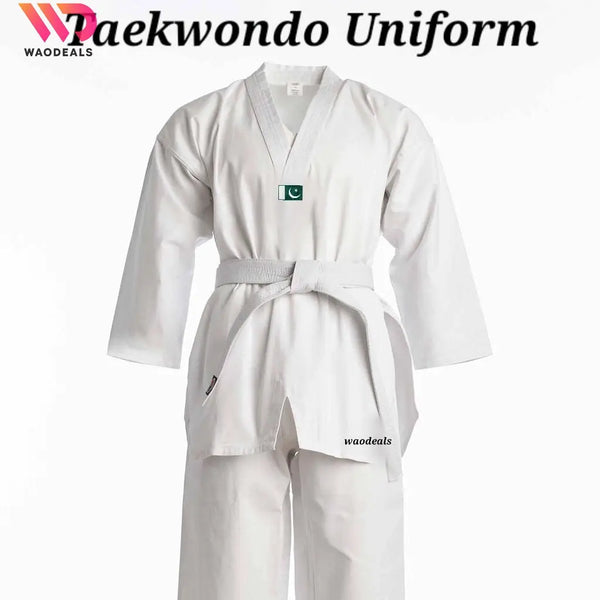 A traditional white Taekwondo uniform with a V-neck jacket and loose-fitting pants, featuring a small green logo on the chest and the brand name 'Woodnitas' on the bottom right.