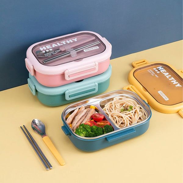 Stacked stainless steel lunch boxes with compartments, shown with a transparent lid, blue, green, and pink color options, accompanied by chopsticks and a spoon.