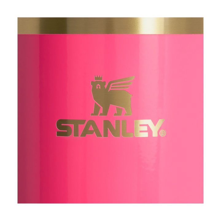 Pink tumbler with gold lid and Stanley logo