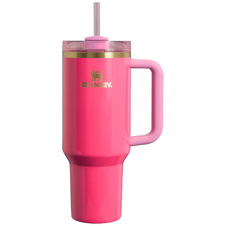 Pink Stanley mug with handle and straw on a white background